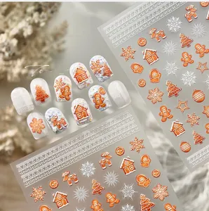 Adesivi per unghie natalizi con omino di pan di zenzero, fiocchi di neve e alberi decorativi