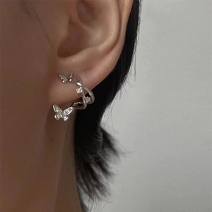 Detail shot of silver butterfly ear cuff with sparkling zircon inlay for women