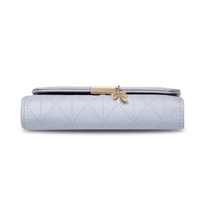 Detail view of light blue quilted PU leather long wallet with golden leaf pendant