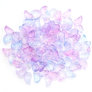Macro shot of 15mm gradient purple and blue butterfly crystal glass beads for DIY jewelry