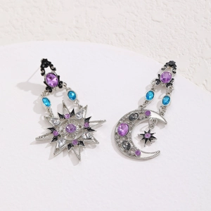 Detail of baroque sun and moon earrings with purple and blue crystals on white stand