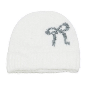 Detail of white knit beanie showing plush mohair texture and grey bow knit pattern