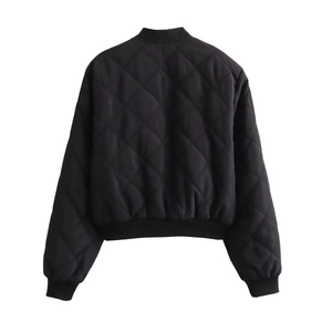 Detail of black quilted bomber jacket featuring ribbed collar and diamond stitch patterns