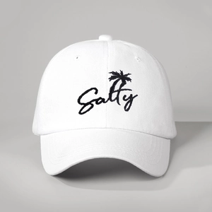 Close-up of Salty palm tree embroidery on a high-quality white cotton baseball cap