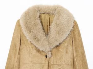 Detail of camel suede blazer featuring a plush faux fur collar and textured fabric