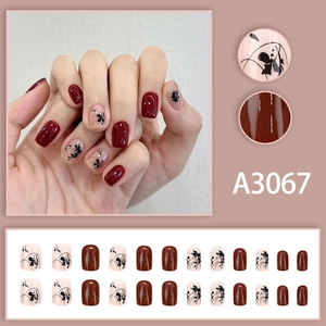 Deep red and nude pink square press-on nails with elegant ink flower patterns