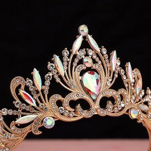 Close-up of golden baroque crown with sparkling crystals and colorful rhinestones