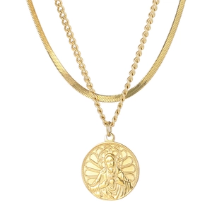 Gold double-layered necklace featuring a snake chain, rope chain, and religious medallion