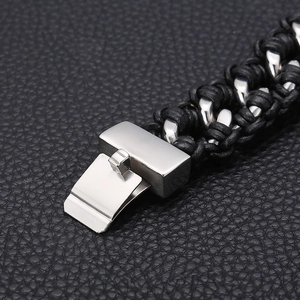 Macro shot of men's leather braided bracelet with polished stainless steel magnetic clasp
