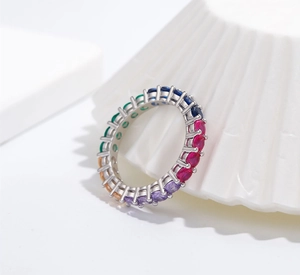 Close-up of a 925 silver rainbow eternity ring featuring vibrant 5A colored cubic zirconia
