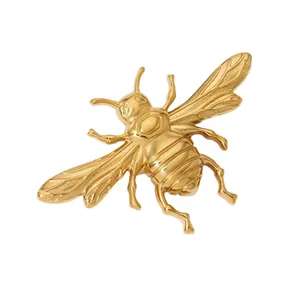 Elegant gold bee brooch in polished stainless steel with detailed wing textures