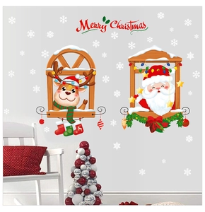 Christmas wall decal featuring Santa and reindeer displayed on a modern grey living room wall