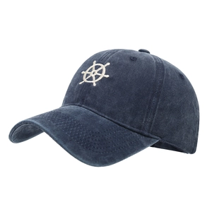 Vintage washed navy baseball cap with white ship wheel embroidery for a classic retro style
