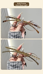 Detail of oval metal frame glasses with heart-shaped hollow and gemstone decorations