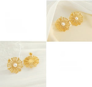 Macro detail of gold flower stud earrings with pearl center on silky fabric