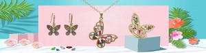 Macro shot of colorful butterfly jewelry set with zircon inlay and gold plating