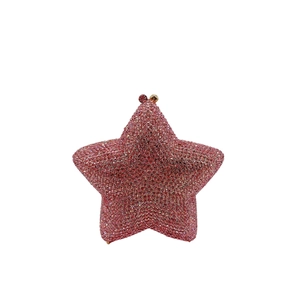 Detailed close-up of a pink star-shaped rhinestone evening clutch with gold metal clasp