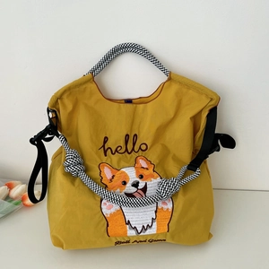 Sac fourre-tout jaune en toile brodée avec motif corgi et bandoulière tissée nouée