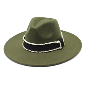 Close-up of olive green wool fedora hat with black grosgrain ribbon and white bead trim