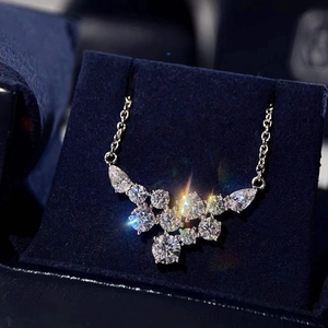 Sparkling cluster pendant necklace with round and pear cut stones on an O-chain link
