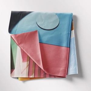 Close-up of bohemian tapestry fabric with modern abstract geometric pattern and vibrant colors