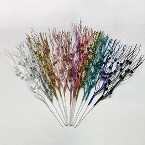 Glitter berry stems in ten different colors arranged in a fan shape for Christmas decor