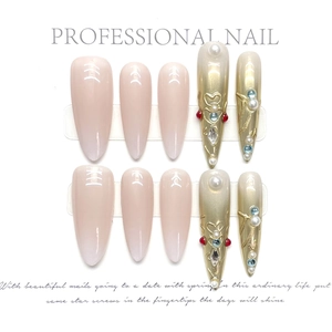 Exquisite handmade press-on nails with pink gradients, pearls, and golden 3D vintage patterns