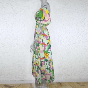 Detail view of colorful floral print dress featuring elastic high waist and puffy sleeves