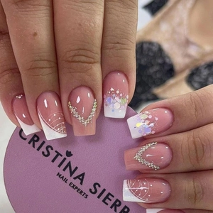 Short square pink press-on nails with white French tips and rhinestone V-accents