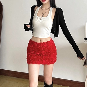 Detail shot of the red 3D rose petal texture on a fashionable mini skirt for women