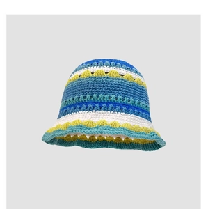 Detailed view of the colorful crochet floral knit pattern and textured wool yarn waves