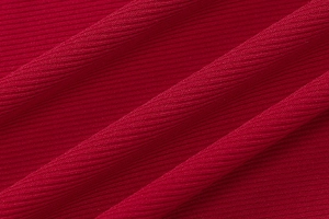 Macro shot of red ribbed fabric texture for slim fit fishtail midi dress
