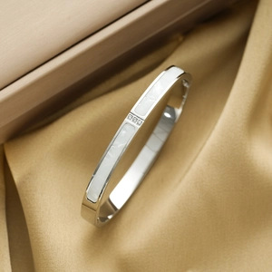 Elegant silver titanium steel bangle with white shell inlay and three sparkling round stones