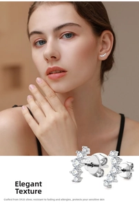 Detail view of 925 silver smile stud earrings with pavé set white moissanite stones