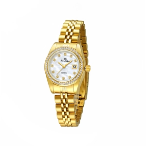 Close-up of gold ladies watch featuring a mother of pearl dial and crystal markers