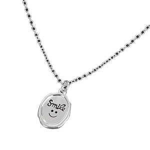 Vintage 925 sterling silver necklace with textured oval pendant and smile face engraving