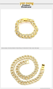 Detail of 15mm gold Cuban link chain necklace and bracelet with iced out rhinestones