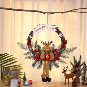 Rustic Christmas wreath with Merry Christmas banner and a cute plush reindeer doll