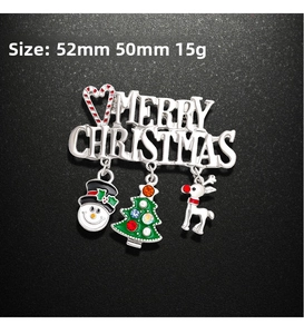 Détail de la broche Joyeux Noël avec bonhomme de neige et sapin en strass mobile