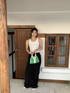 Chic green and white checkered crochet tote bag paired with casual summer outfit