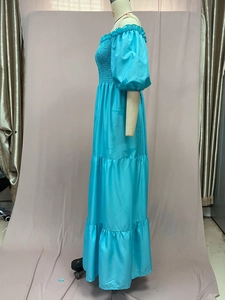 Detail of blue floral off-shoulder dress with ruffled bodice and tiered satin skirt