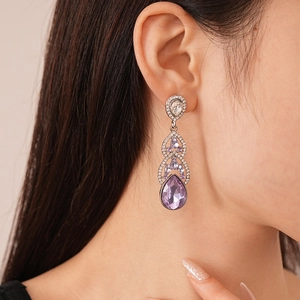 Elegant luxury drop earrings with purple teardrop crystals and silver plating