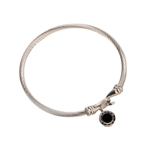 Silver twisted cable stainless steel bangle featuring a black Roman numeral charm pendant
