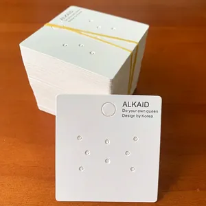 Detailed size view of 5.2x5.4cm white jewelry display cards with 8 earring holes