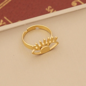 Macro shot of gold-plated evil eye adjustable open ring with eyelash detail