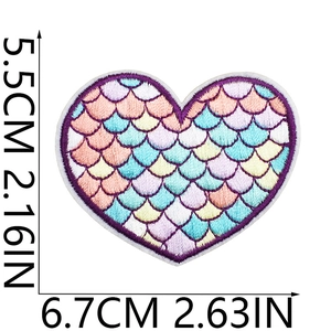 Detailed view of heart-shaped embroidery patch with colorful scales and dimensions