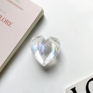 Close-up of laser heart phone grip with faceted crystal texture and rainbow reflection
