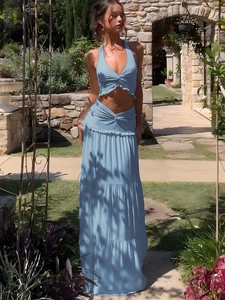 Women's light blue summer two-piece set with a halter twist crop top and ruffled maxi skirt