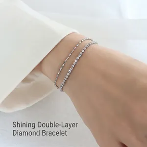 Double-layered stainless steel bracelet with silver beads and shimmering cubic zirconia stones
