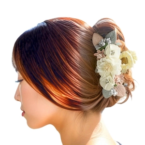 Floral hair claw clip with white fabric flowers and rhinestones for elegant updo hairstyles
